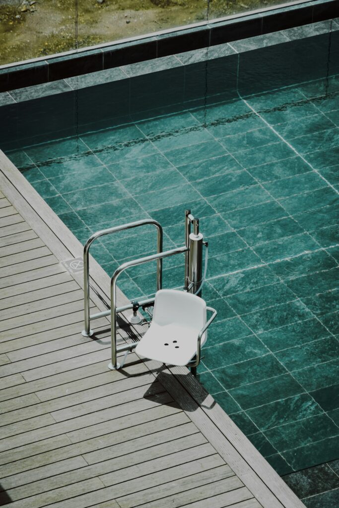 Pool chair lift for wheelchair accessible hotel design
